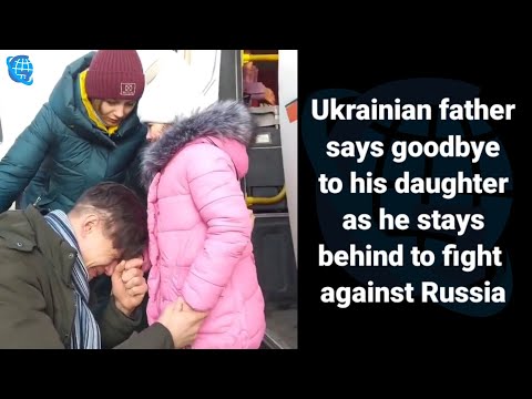 Ukrainian father says goodbye to his daughter as he stays behind to fight against Russia#ukraine