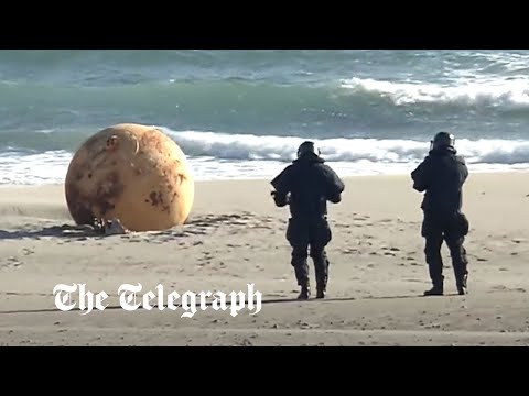Spy balloon? Japan baffled by mysterious metal ball washed up on beach