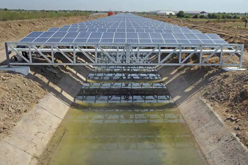 Solar Panels over Canals in India, which prevent water evaporation and increase panel efficiency