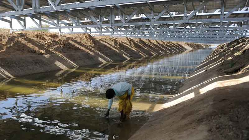 Solar Panels over Canals in India, which prevent water evaporation and increase panel efficiency