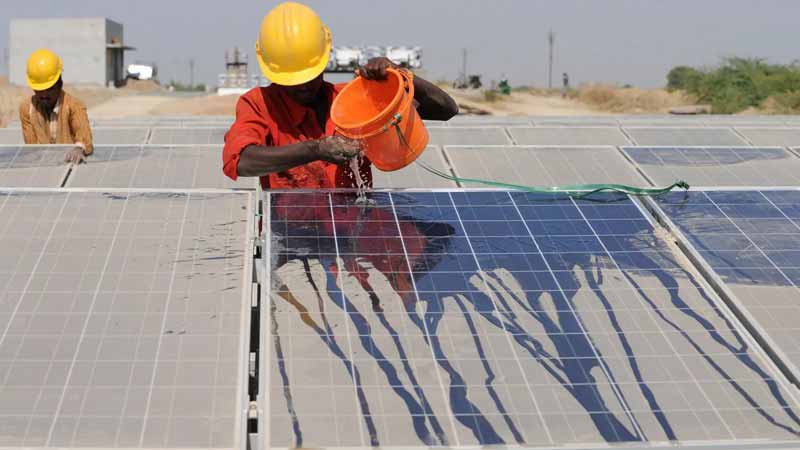 Solar Panels over Canals in India, which prevent water evaporation and increase panel efficiency