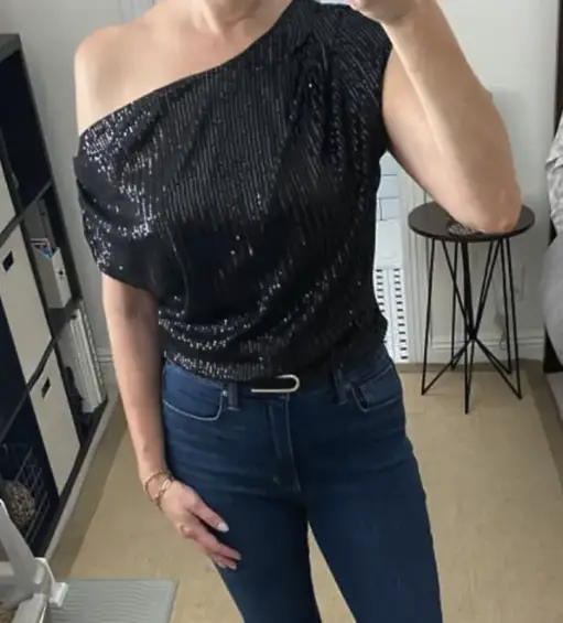 Looking for a holiday-ready top that’s festive but not over-the-top? This off-shoulder sequin top is a total game-changer. It has all the sparkle of the season without the drama of a bodycon dress.