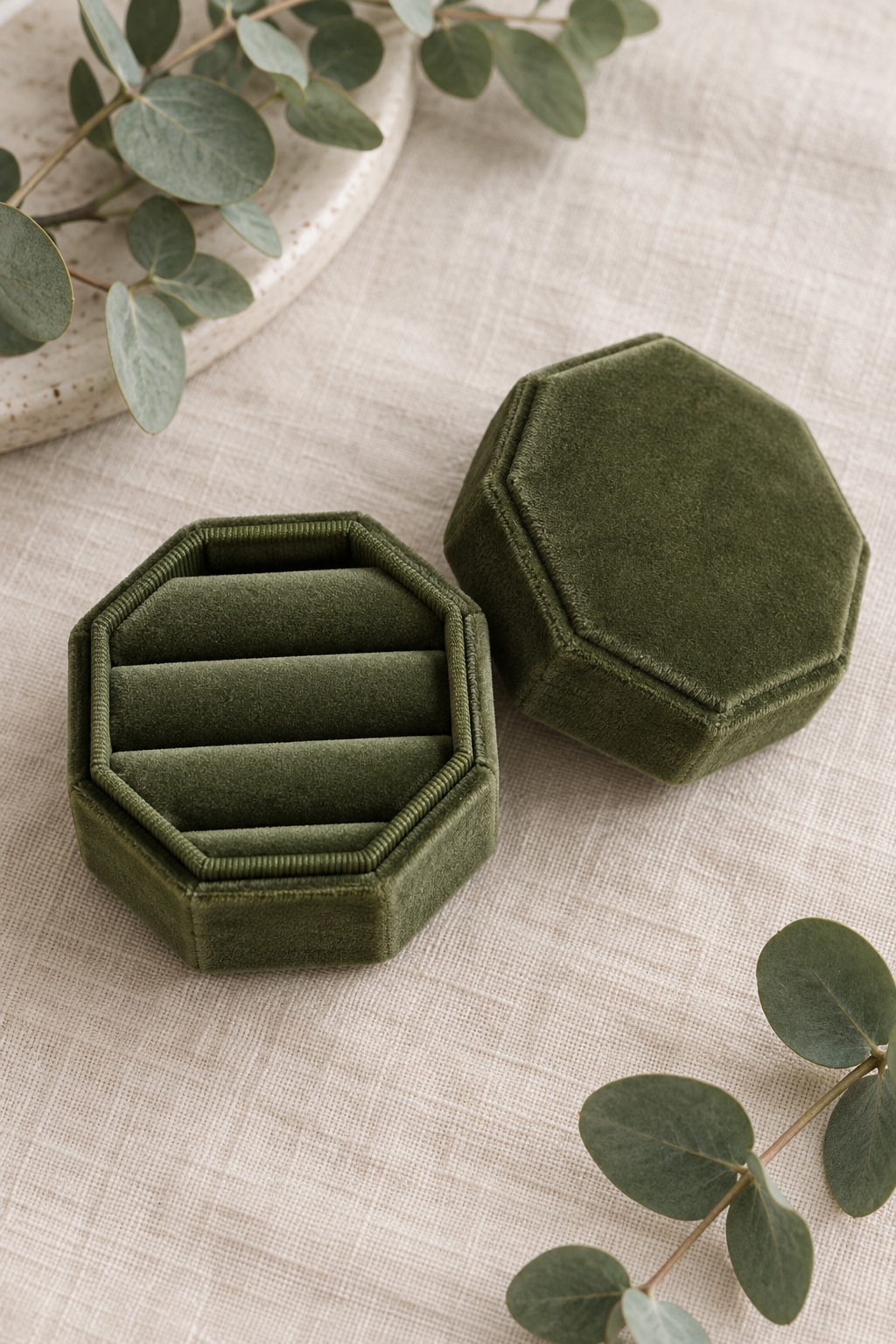 Moss-green octagonal three-slot velvet ring box with removable lid.