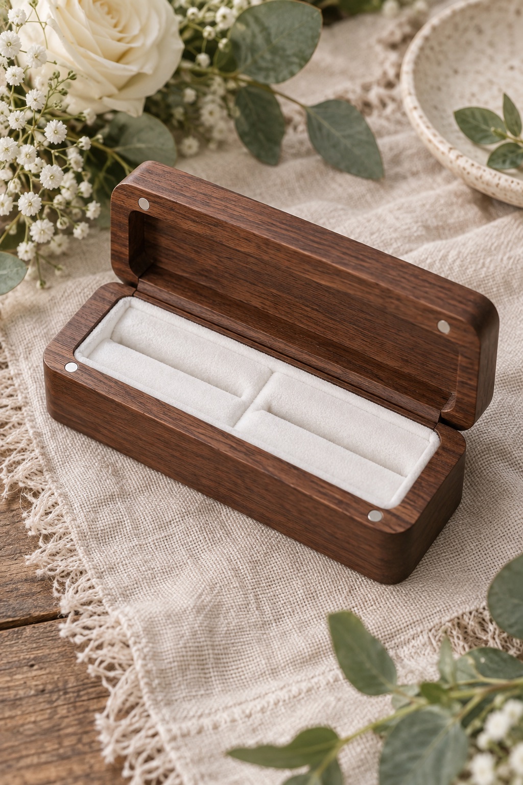 Slim walnut wood two-ring box open on rustic wedding linen