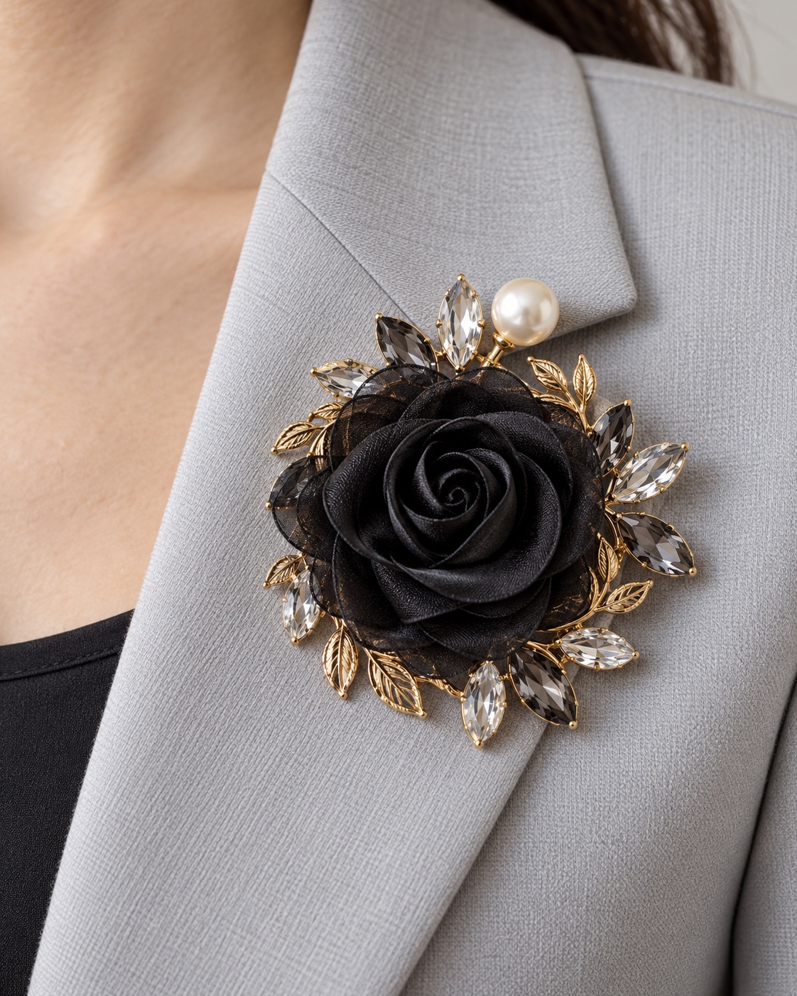 Black fabric rose brooch with gold leaves, marquise stones, and one pearl